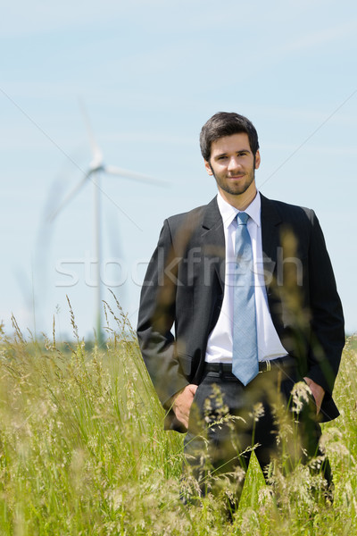 Green energy - Young businessman in field windmill  Stock photo © CandyboxPhoto