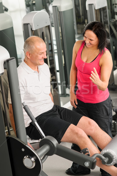 Fitness center active man exercising with trainer Stock photo © CandyboxPhoto