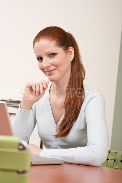 Stock photo: Long red hair  business woman with laptop