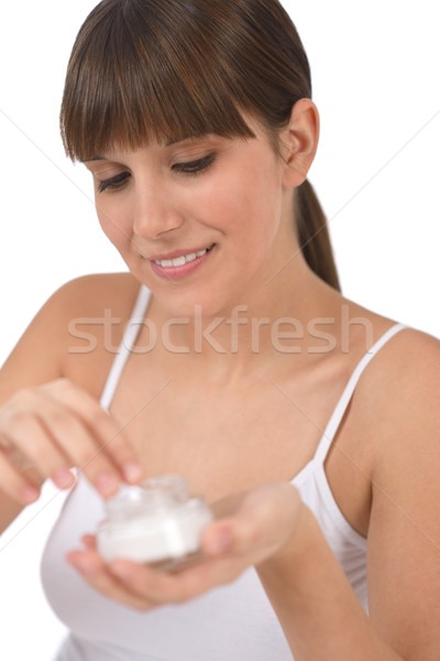 Body care - Female teenager applying moisturizer cream Stock photo © CandyboxPhoto