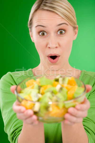 Healthy lifestyle - woman holding fruit salad bowl Stock photo © CandyboxPhoto