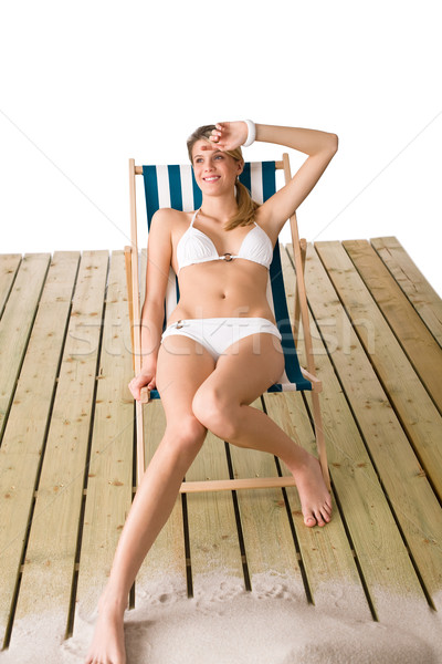 Beach - Woman in bikini sunbathing on deck chair Stock photo © CandyboxPhoto