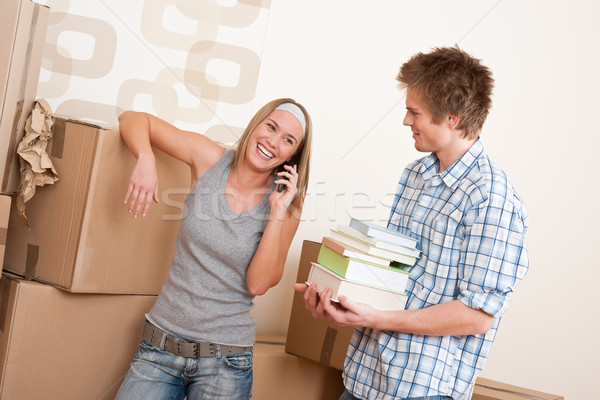Moving house: Young couple with box in new home Stock photo © CandyboxPhoto