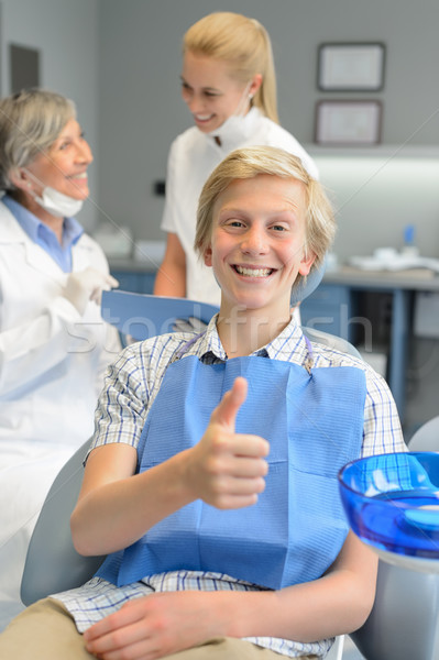 Teenager patient thumbup at dental surgery dentist Stock photo © CandyboxPhoto