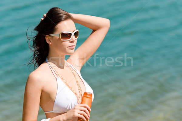 Summer young woman with suncream in bikini Stock photo © CandyboxPhoto
