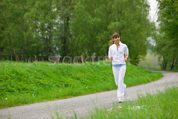 Joggen Frau läuft Straße Natur hören Stock foto © CandyboxPhoto
