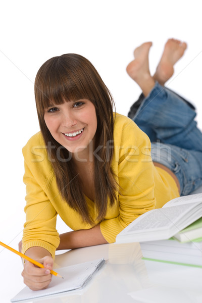 Student vrouwelijke tiener schrijven huiswerk boek Stockfoto © CandyboxPhoto