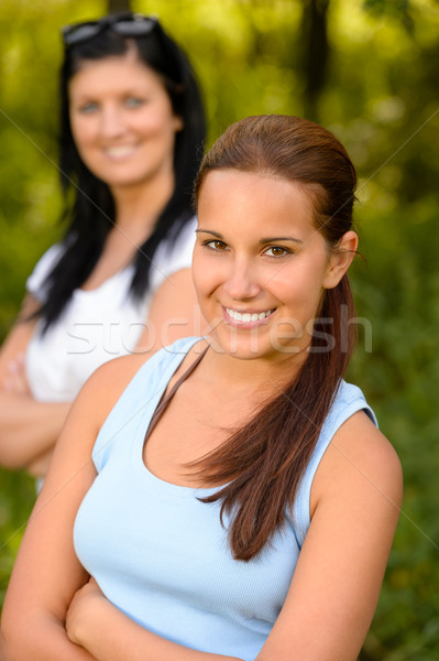 Teen girl smiling with mother in background Stock photo © CandyboxPhoto