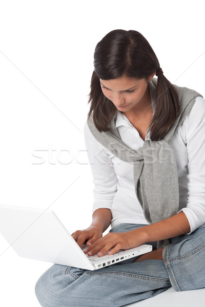 Imagine de stoc: Adolescent · şedinţei · laptop · alb · calculator · fericit