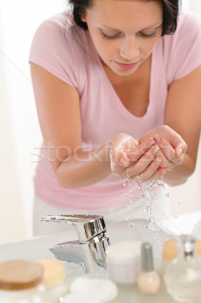 Woman washing face with water in bathroom Stock photo © CandyboxPhoto