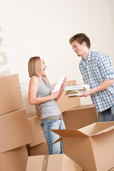 Moving house: Young couple with box in new home Stock photo © CandyboxPhoto