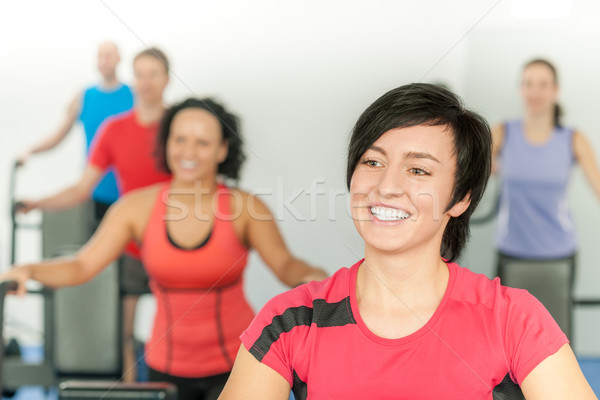 Smiling woman at fitness class gym workout Stock photo © CandyboxPhoto