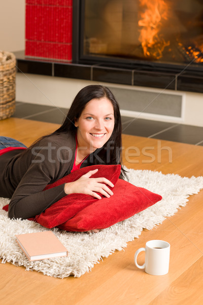 Home living happy woman lying by fireplace Stock photo © CandyboxPhoto