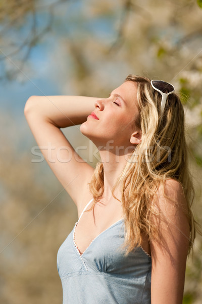 Spring - Young woman under blossom tree in orchard Stock photo © CandyboxPhoto