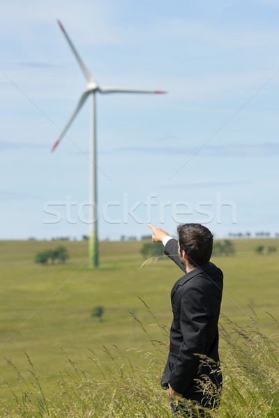 Green energy - Young businessman point windmill  Stock photo © CandyboxPhoto