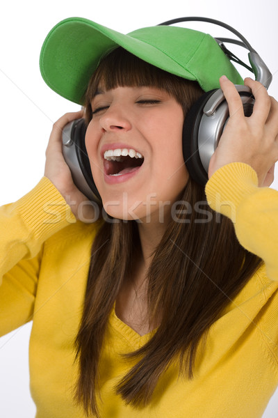 Happy female teenager enjoy music with headphones  Stock photo © CandyboxPhoto