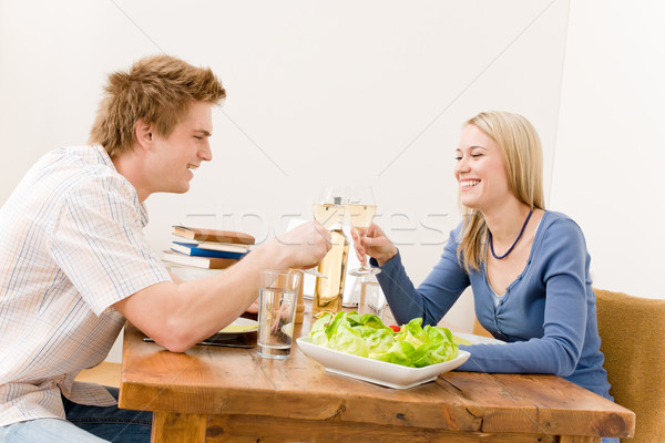 Stock photo: Happy couple enjoy wine eat salad kitchen