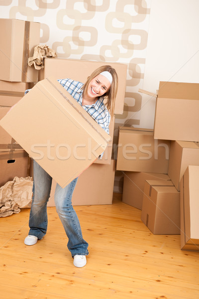 Moving house: Woman holding big carton box Stock photo © CandyboxPhoto