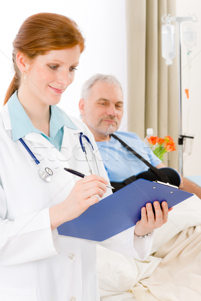 Stock photo: Hospital - doctor examine patient broken arm