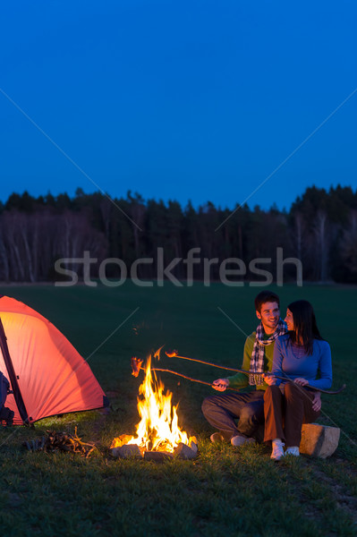 Stock photo: Camping night couple cook by campfire romantic