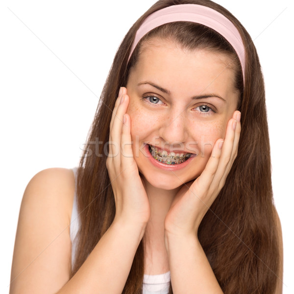 Happy girl with braces isolated Stock photo © CandyboxPhoto