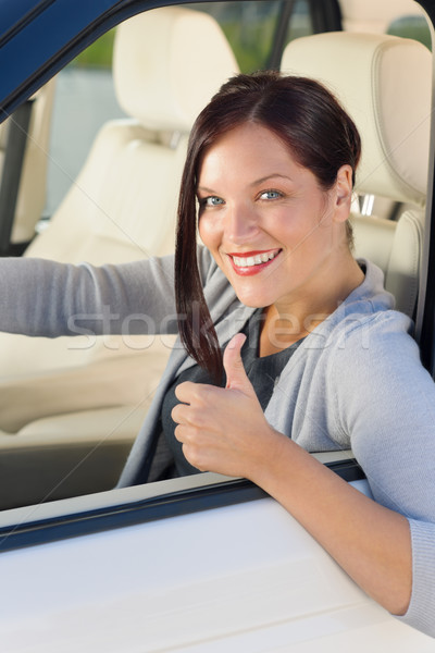 Stock photo: Attractive businesswoman in luxury car thumb-up