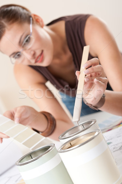 Female designer with can of paint choosing color Stock photo © CandyboxPhoto