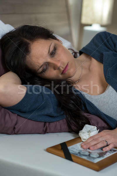 Sad Caucasian widow lying in bed Stock photo © CandyboxPhoto