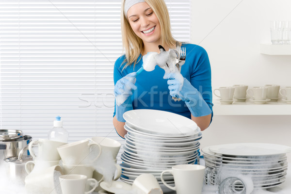 Stock photo: Modern kitchen - happy woman washing dishes