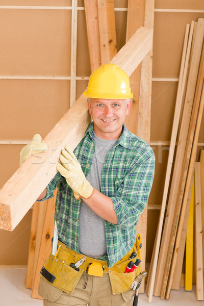 Stock photo: Handyman carpenter mature carry wooden beam