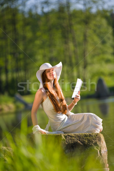 Long red hair romantic woman relax by lake with book  Stock photo © CandyboxPhoto