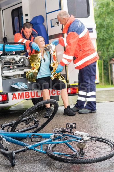 Emergency paramedics helping woman bike accident Stock photo © CandyboxPhoto