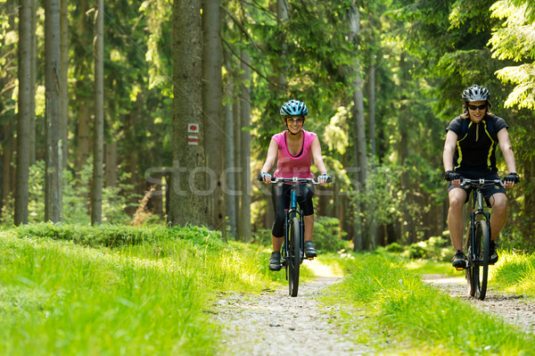 Cheerful biker couple in woods Stock photo © CandyboxPhoto