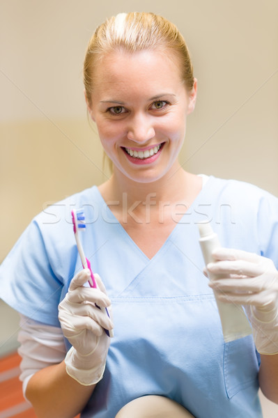 Dental hygienist hold toothbrush and toothpaste Stock photo © CandyboxPhoto