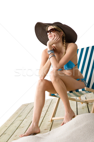 Beach - Young woman in bikini sitting on deck chair  Stock photo © CandyboxPhoto