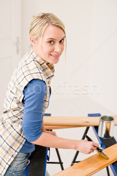 Home improvement - handywoman painting wooden plank Stock photo © CandyboxPhoto