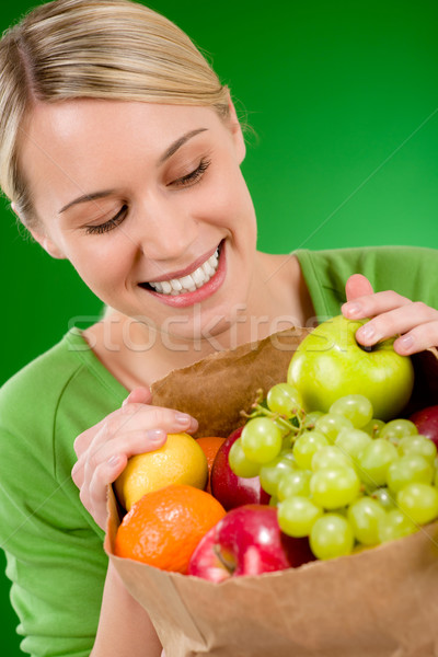 Healthy lifestyle - woman with fruit shopping paper bag  Stock photo © CandyboxPhoto