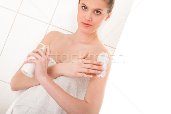 Body care series - Young woman applying lotion Stock photo © CandyboxPhoto