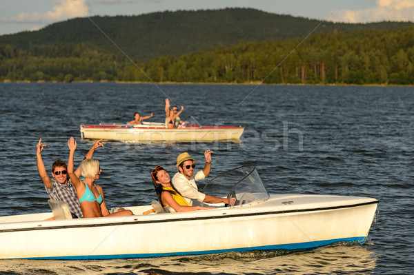Group of friends racing with motorboats Stock photo © CandyboxPhoto