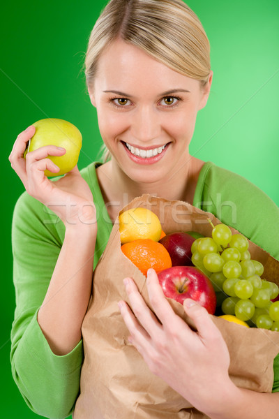 Stock photo: Healthy lifestyle - woman with fruit shopping paper bag