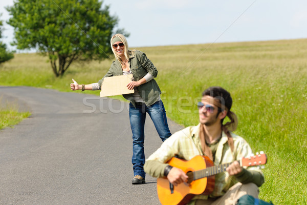 Stock photo: Hitch-hiking young couple backpack asphalt road