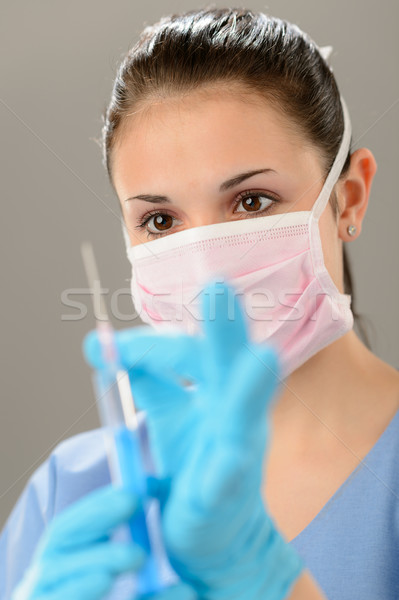 Portrait of female physician holding syringe Stock photo © CandyboxPhoto