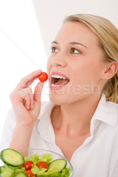 Healthy lifestyle - woman with vegetable salad bite cherry tomat Stock photo © CandyboxPhoto
