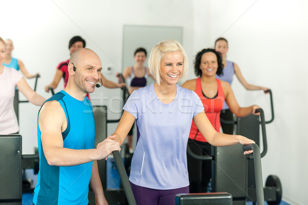 Fitness instructor leading gym people exercise Stock photo © CandyboxPhoto