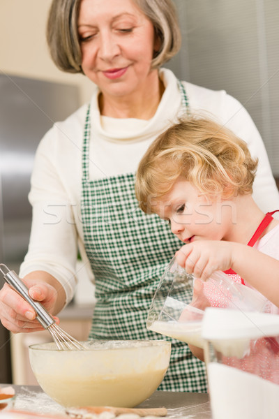 Grandmother and granddaughter baking together Stock photo © CandyboxPhoto