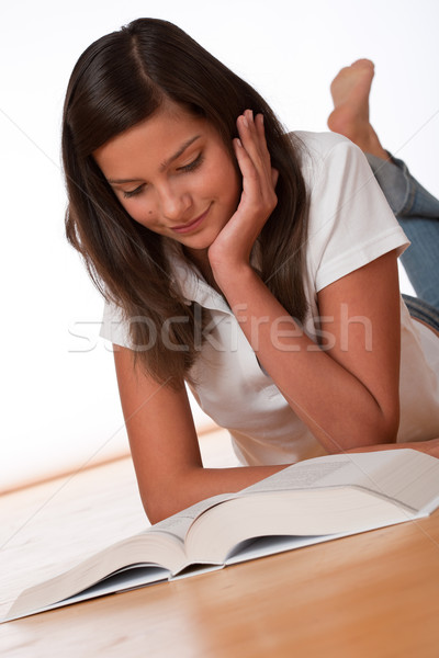 Teenager reading book lying down Stock photo © CandyboxPhoto