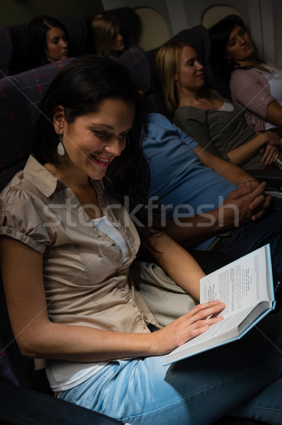 Young woman read book plane night flight Stock photo © CandyboxPhoto