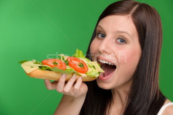 Stock photo: Healthy lifestyle - woman bite cheese sandwich