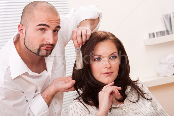 Stock photo: Professional hairdresser choose hair dye color at salon