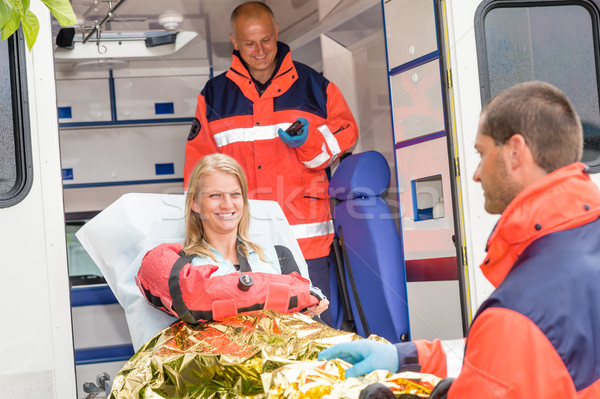 Woman with broken arm in ambulance paramedics Stock photo © CandyboxPhoto
